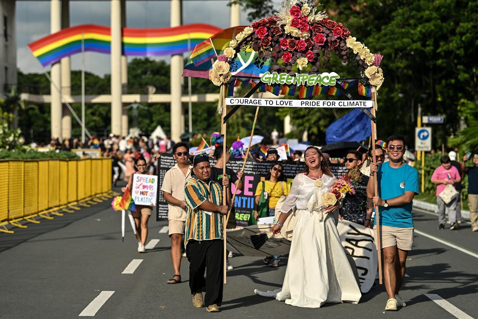 Jean Golong wears Filipiniana gown with climate justice message at Pride 2025 [photo credit: Noel Celis / Greenpeace]