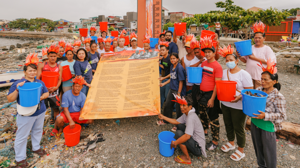 Navotas residents call for stronger climate action and environmental protection. [photo credit: Jilson Tiu | Greenpeace]